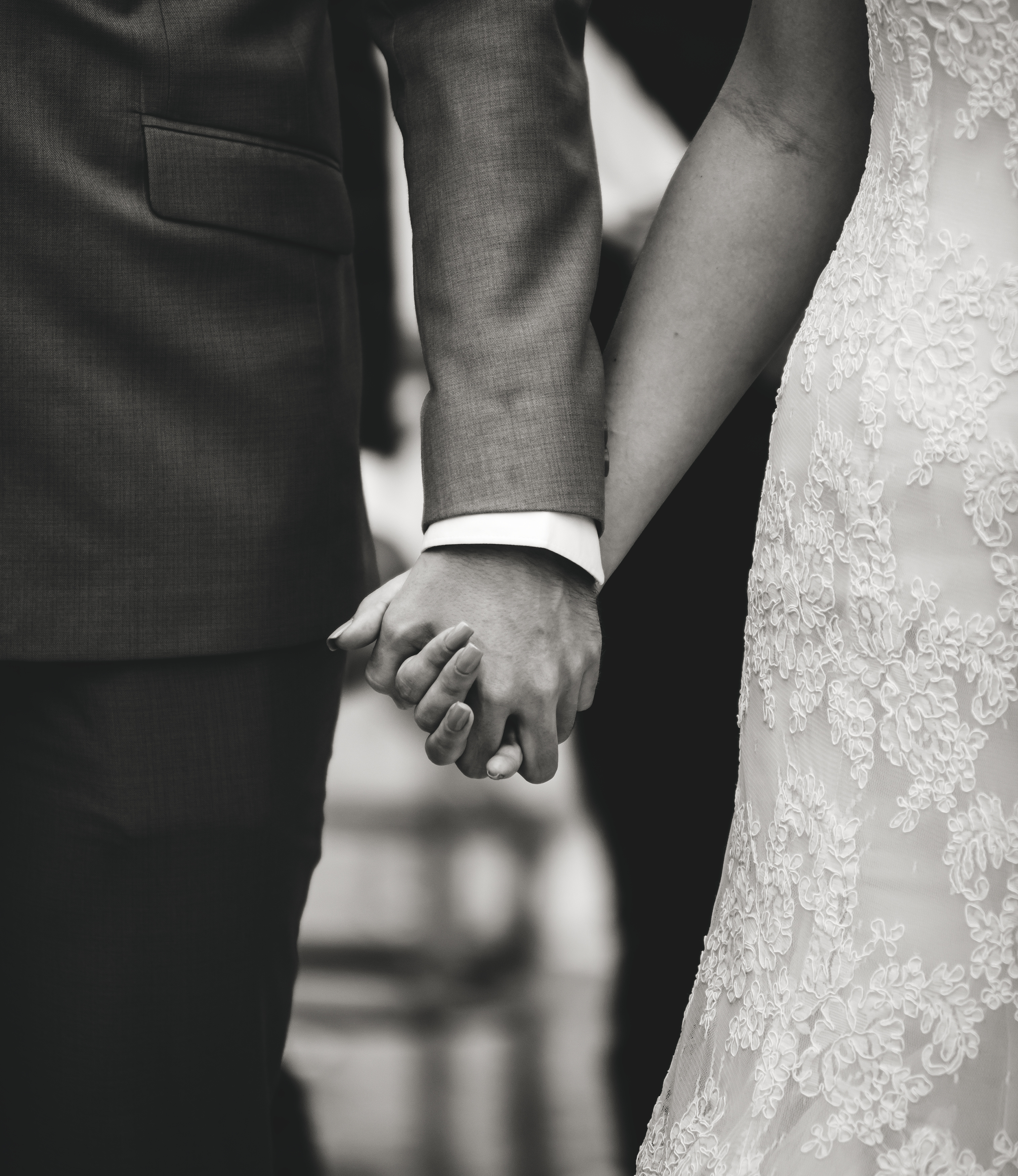 bride-groom-holding-hands